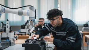 Student engineer Assembling Robotic Arm